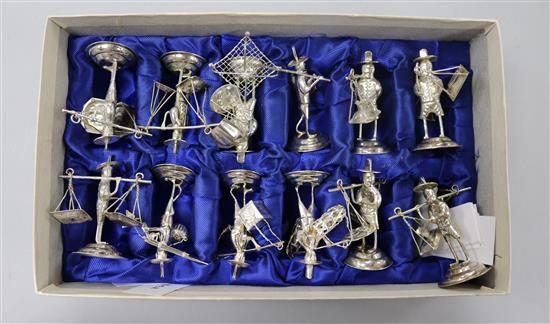 A cased set of twelve continental sterling silver figural menu holders.